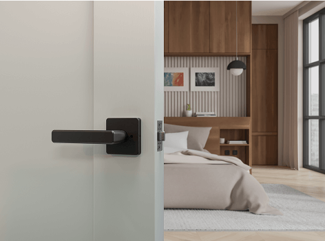 Open door with Schlage lock, revealing modern bedroom interior.